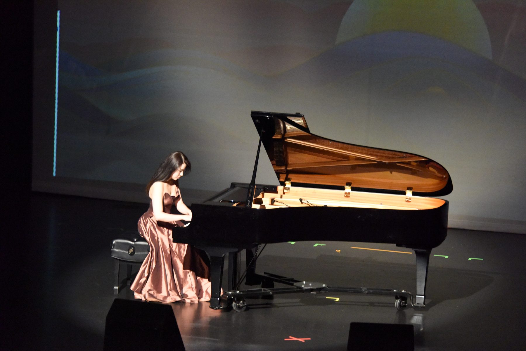 Hellena Yang performing on a concert stage